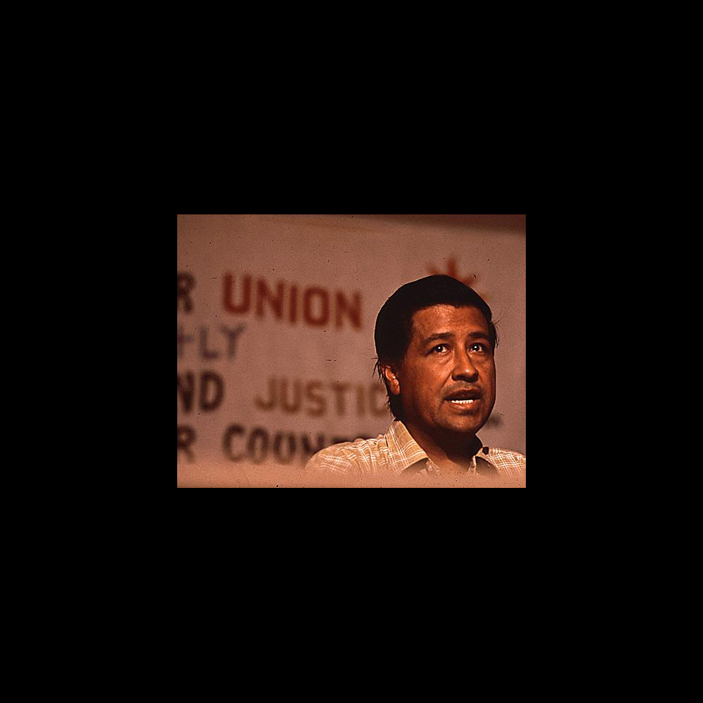 Cesar Chavez speaking at an event.